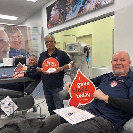 Photo Slide 8: Team giving blood at Red Cross